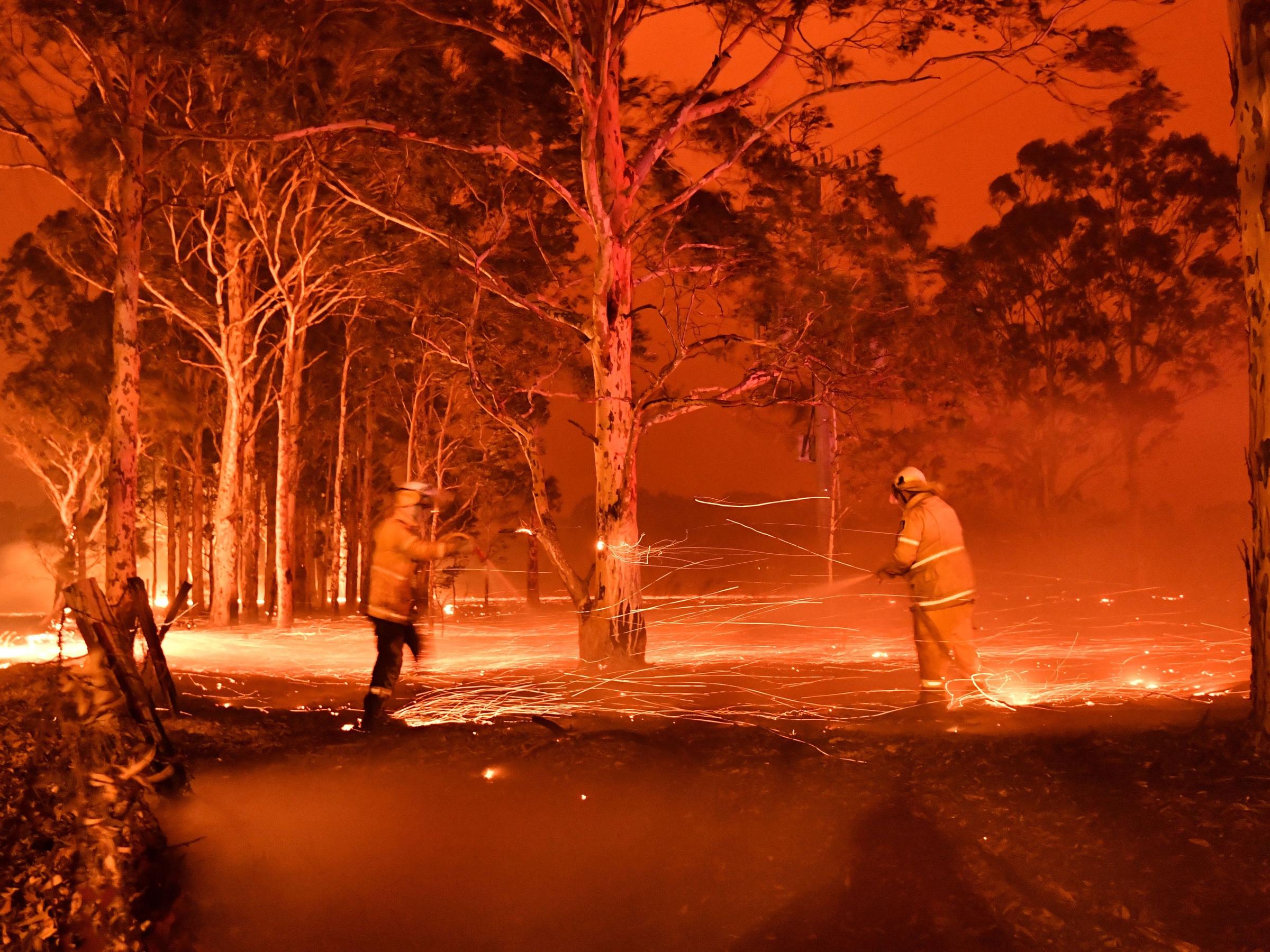 Firefighters battling a bushfire at night